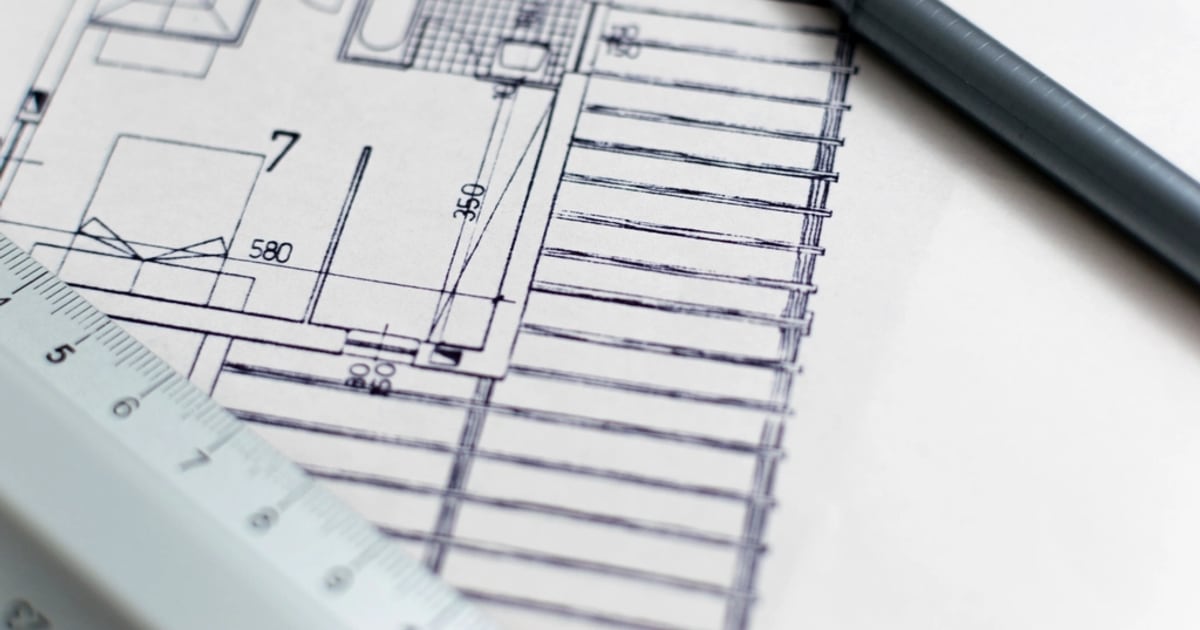 Architectural floor plan with a pen and a scale ruler
