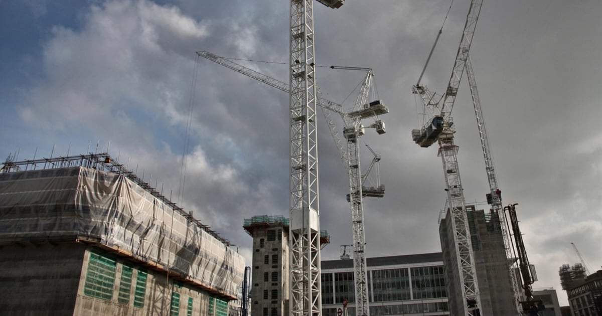 Tower cranes above a building under construction
